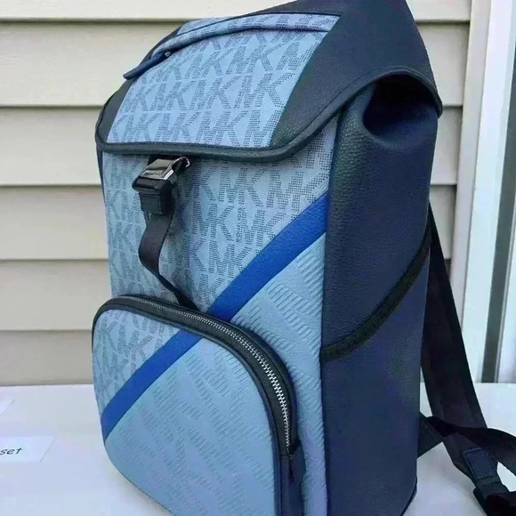 cooper embossed faux leather and logo stripe backpack while an outside zip compartment and side slip pockets offer easy access to smaller essentials Michael Kors Outlet Cooper Pebbled